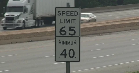 Speed Limit Sign - 65 mph - Interstate Highway Stock Footage 77908224