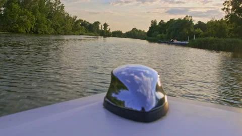Speed motorboat goes on river between green coastline. View from the bow of t Stock Footage 148336501