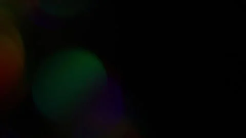 The speed of rainbow colored light on the left side of the frame in the dark Video stock 309891533