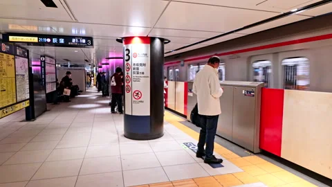 Speed Ramp of crowd of passenger rush to board Metro Train on Tokyo Metro Stock Footage 189494709