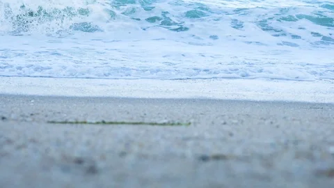 Speed ramp of waves breaking on the beach Stock Footage 94366463