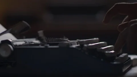 Speed ramps of a man typing at an old dusty vintage typewriter Stock Footage 97843946