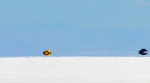 Speed Record Breaking Yellow Car Prototype at Salt Flats HD Stock Footage 40714139