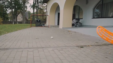 Speed test speedometer young boy shoots at the gate with floorball hockey stick Stock Footage 119151109