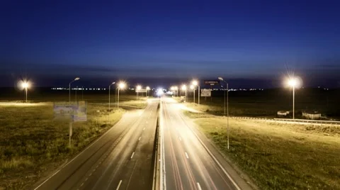 Speed Traffic at Sundown Time - light trails on motorway highway at night Stock-Footage 52565663