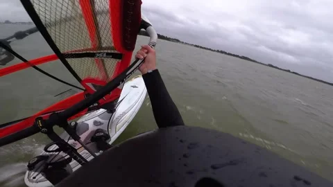 Speed windsurfing with a small red sail Stock Footage 140198270