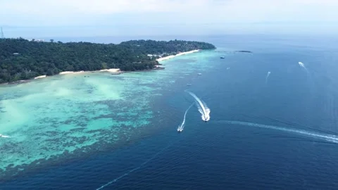 Speedboat Crossing Phi Phi Ocean Tilt Track Drone Shot in 4K Stock Footage 233370318