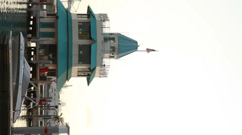 Speedboat moored by the Control Tower. Vertical (9:16) shot. Stock Footage 39246678