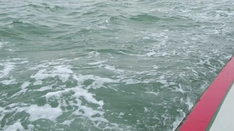 Speedboat moving through lagoon with wake 스톡 동영상 332305546