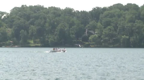 Speedboat pulling a tube Stock Footage 10683688