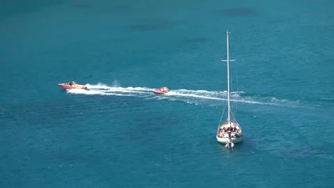 Speedboat pulls at high speed an inflatable surface Video stock 141779608