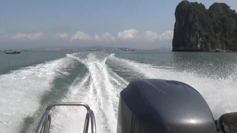 A speedboat running on the sea creates waves at its stern Stock Footage 332288785