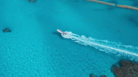 Speedboat Sailing Over Clear Turquoise Water, Aerial View Video stock 314746512