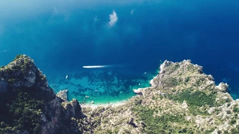 Speedboat speeding up along Capri coastline on a beautiful summer morning, Italy Stock Footage 246749052