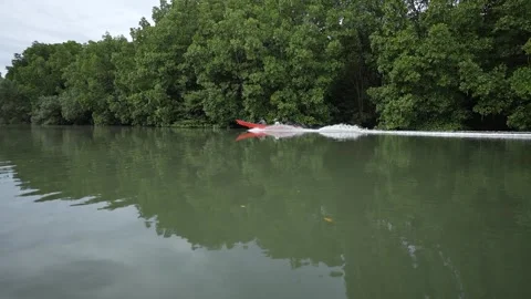 A speedboat was speeding alongside the drafting boat Stock Footage 255869410