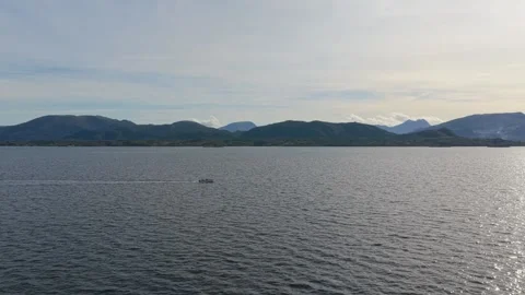 Speedboat zips across open Atlantic waters near Norway, aerial shot Stock Footage 320732288