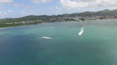 Speedboats on ocean as drone pulls into coastline Stock Footage 66337913