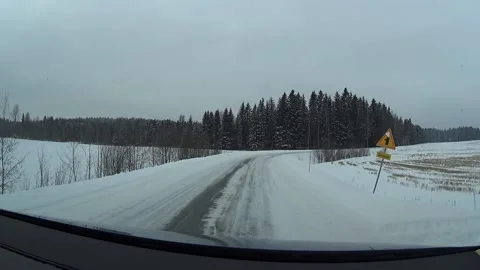 Speeding along empty highway through snowy fields Stock Footage 145580638