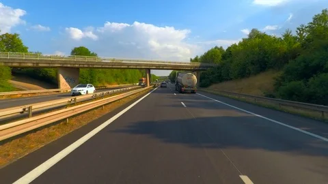 Speeding on the Autobahn Camera glides in the stream of cars Video stock 114038190