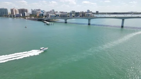 Speeding boat under the John Ringling Causeway in Sarasota, Florida Stock Footage 152199213