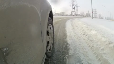 Speeding car on snowy roads Stock Footage 19023348