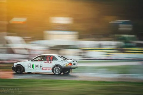 Speeding car at sunset Stock Photos