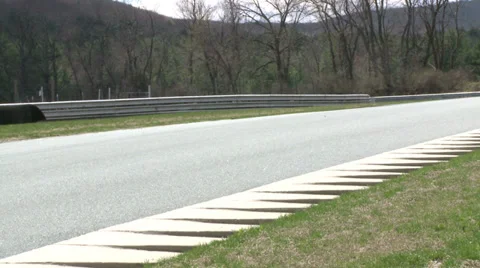 Speeding down a raceway (3 of 8) Stock Footage 32038418