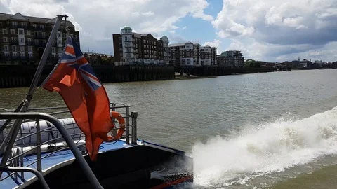 Speeding down the River Thames on a ferry, 4K Stock Footage 110378825