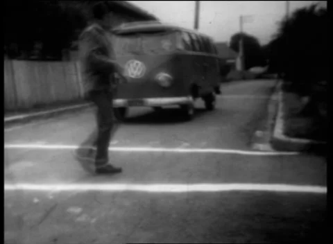 SPEEDING DRIVER ALMOST HITS PEDESTRIAN (1950s ARCHIVE FOOTAGE) Stock Footage 256952784