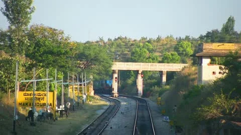 Speeding evening passenger train near Bangalore India. Stock Footage 21238361