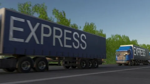 Speeding freight semi trucks with EXPRESS caption on the trailer. Road cargo Stock Footage 75777547