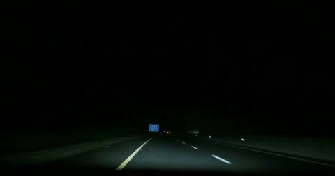 Speeding on motorway though fog clouds at night Video stock 45370791