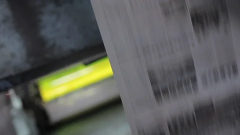 Speeding Newspaper Rolls Going Through Printing Machine Close Up Video stock 134495872