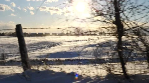 Speeding past snow landscape during sunset at winter snowstorm Stock Footage 171908287