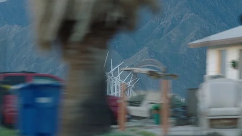 Speeding past windmills in the distance Stock Footage 106474081