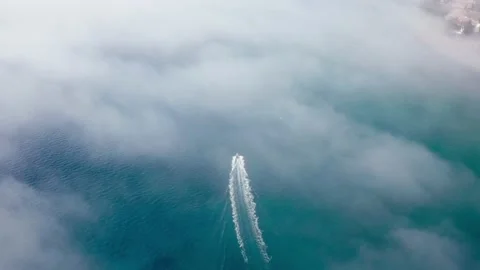 Speeding raft through misty ocean Stock Footage 167554447