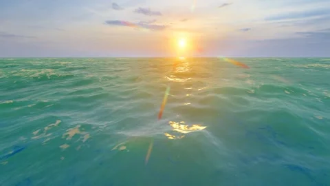 Speeding through the sea at dusk and sunset Stock Footage 242498451