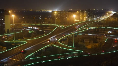Speeding up traffic road at overpass intersection at night Stock Footage 271472758