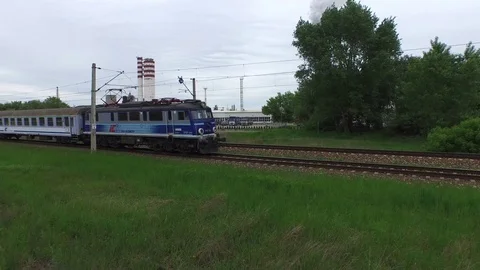 Speeding train, factory background, aerial view Stock Footage 86858037
