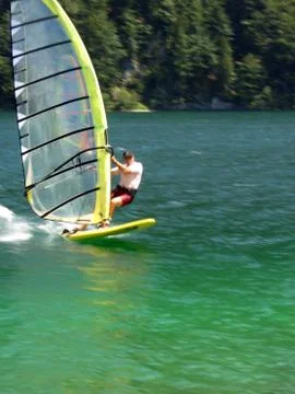 Speeding windsurfer panning blur 스톡 사진