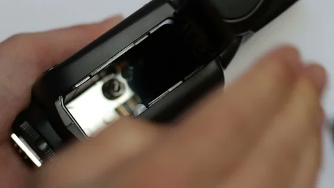 The speedlight's rechargeable battery Stock Footage 127697682