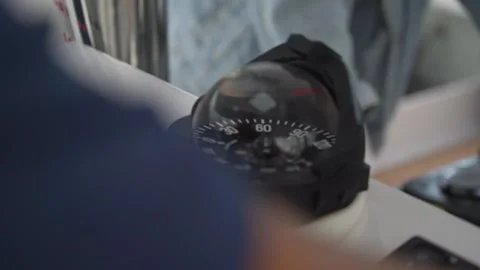 Speedometer and compass with dome cup on dashboard of tourist yacht Stock Footage 153259534