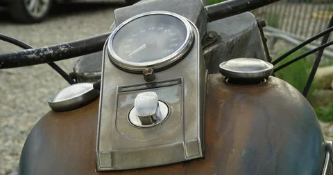 Speedometer guage and fuel cap on rustic motorcycle dash Stock Footage 123010073