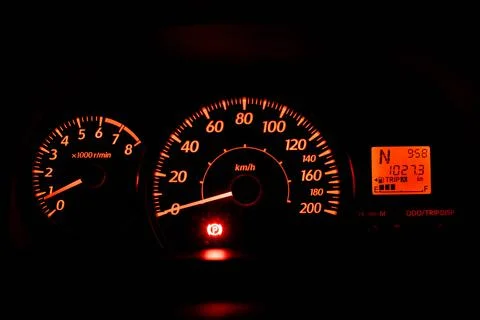 Speedometer with orange backlight Stock Photos