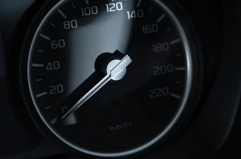 Speedometer shows current speed of a vehicle on a road Stock Photos