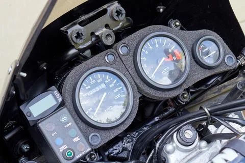 Speedometer, tachometer and handle bar of motorcycle Stock Photos