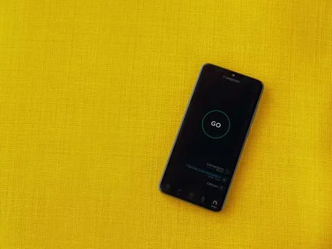 Speedtest app launch screen with logo on the display of a black mobile smartp Stock Photos