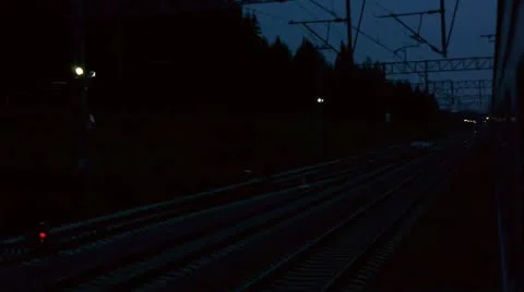 Speedy train goes near the other train, night view from train window Stock Footage