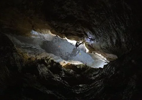 Speleologist at the bottom of the cave Stock Photos