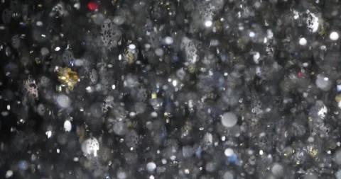 Spellbound silver confetti fly at festive party creating magical Stock Footage 312928150